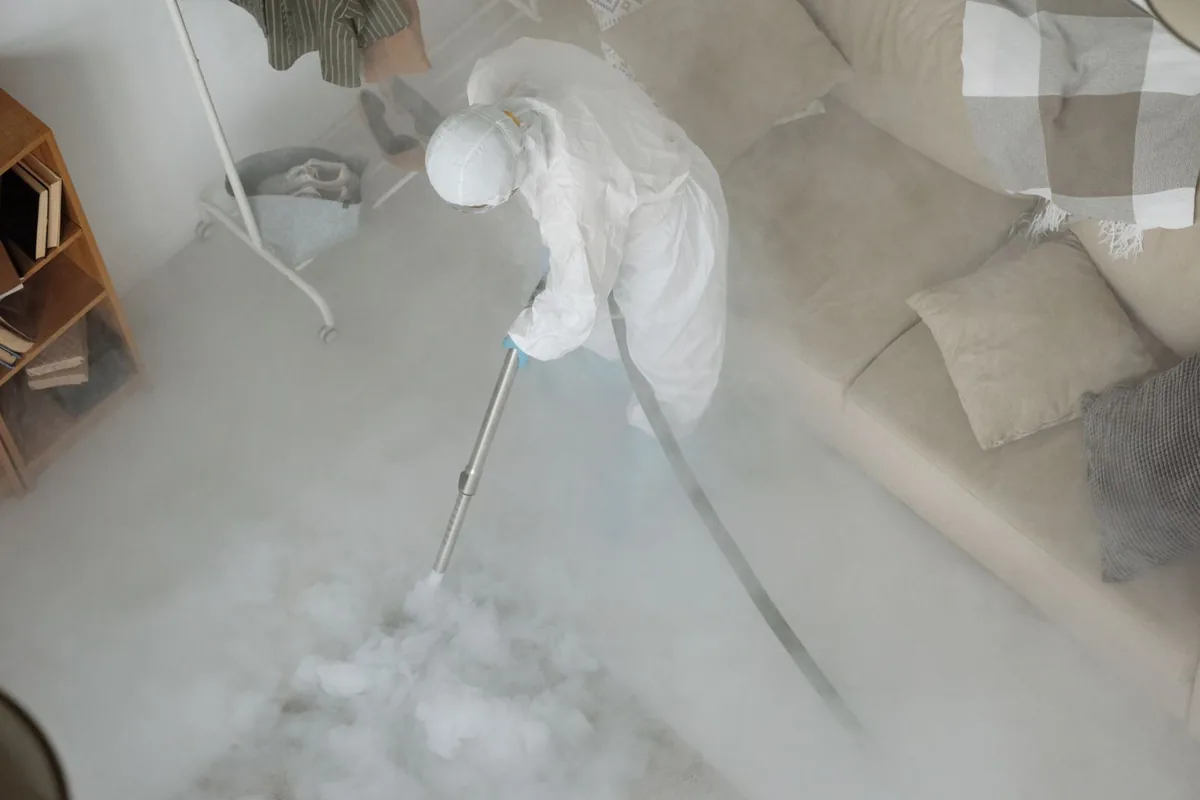 Biohazard cleanup technician in protective equipment, Ridgeway, VA